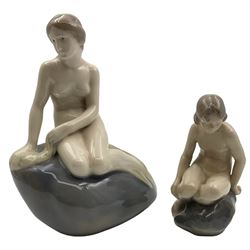 Two Royal Copenhagen figures, comprising The Little Mermaid, modelled by Edvard Eriksen, no. 4431 and Royal Copenhagen girl on stone no 4027, Little Mermaid H22cm