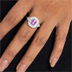 Platinum pink sapphire and diamond milgrain set cluster ring, single octagonal cut sapphire of approx 0.95 carat, surrounded by twelve old cut diamonds, with baguette cut diamond shoulders, stamped Plat, total diamond weight approx 0.70 carat
