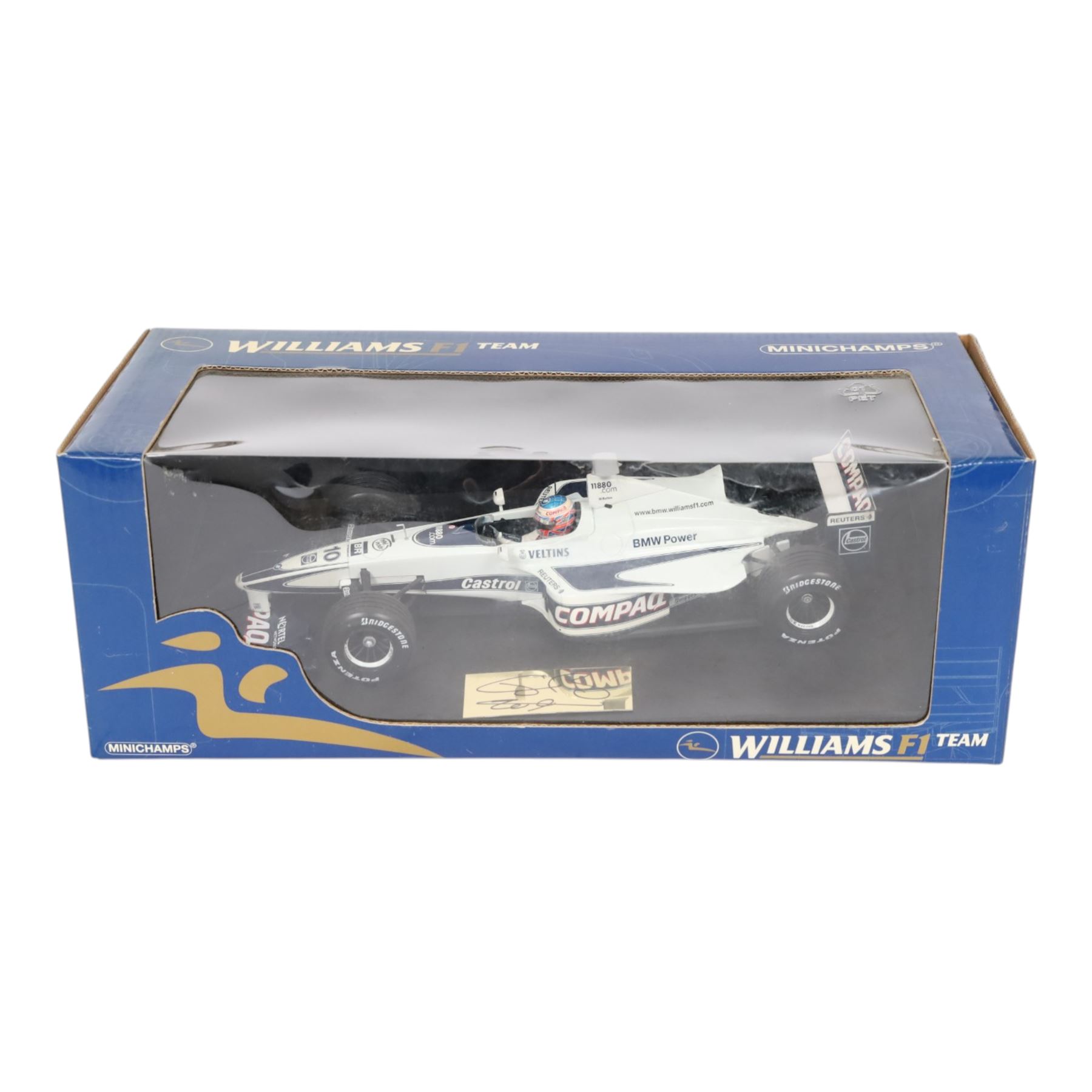 Three signed limited edition 1:18 scale Formula One models, comprising Hot Wheels Jordan EJ12 signed by Takuma Sato, Hot Wheels Jaguar Racing R2 signed by Eddie Irvine and a Minichamps Williams F1 Team model signed by Jenson Button, 1:18 scale model, all boxed