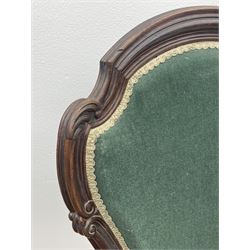 Set three Victorian rosewood drawing room side chairs, shaped and moulded frames carved with scrolls, upholstered in green velvet, serpentine sprung seats, the cabriole supports carved with flower heads