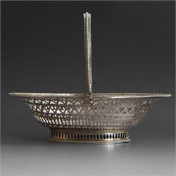 George III silver bon bon basket, of oval form with bead rim and swing handle, the sides w...