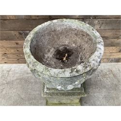 Cast stone centerpiece urn on plinth