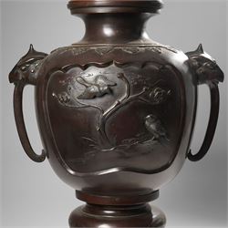Japanese late Meiji period bronze koro and cover, surmounted by an eagle finial and with bird decoration in high relief to each side, twin elephant trunk handles, bearing indistinct character signature to one side, H82cm
