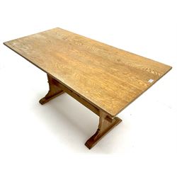 Mid 20th century rectangular oak dining table, shaped solid end supports joined by stretcher on sledge feet 