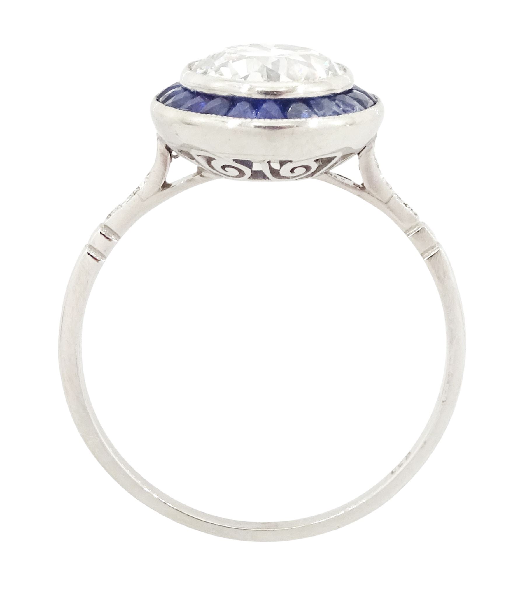 Platinum diamond and sapphire target ring, milgrain set single old cut diamond of 1.53 carat, with calibre cut sapphire surround and rose cut diamond set shoulders, stamped 950
