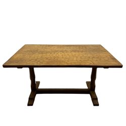 'Eagleman' oak dining table with adzed rectangular top, twin octagonal pillar supports joined by floor stretcher, relief carved inset Eagle signature, by Albert Jeffray of Sessay, Thirsk