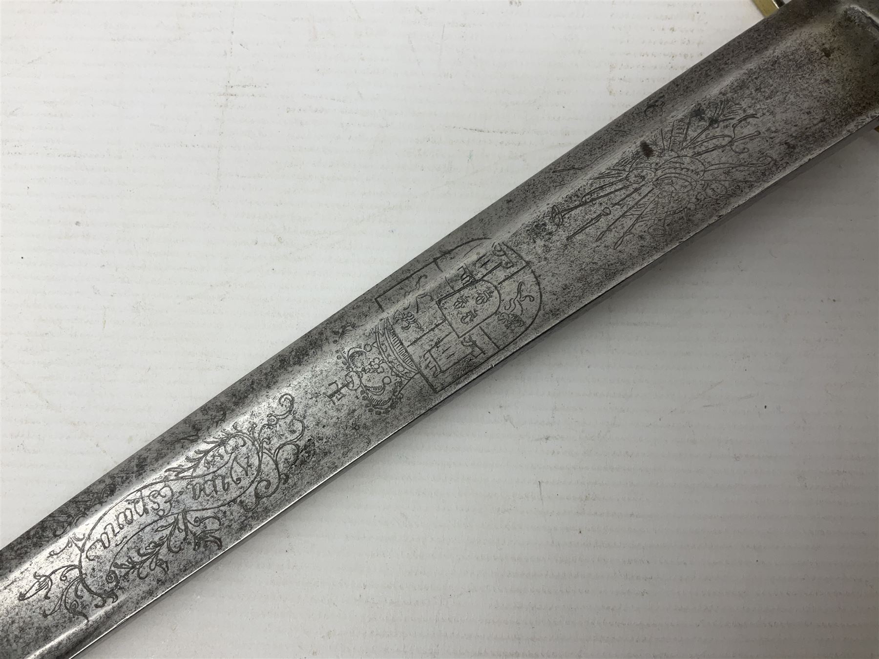 Late 18th century sword, the Spanish 79.5cm curving fullered blade engraved with the Royal Cypher, battle trophies and 'Viva Espania' banner, French Sabre de Mineur brass three-bar hilt with ebonised reeded grip L93.5cm overall (no scabbard)