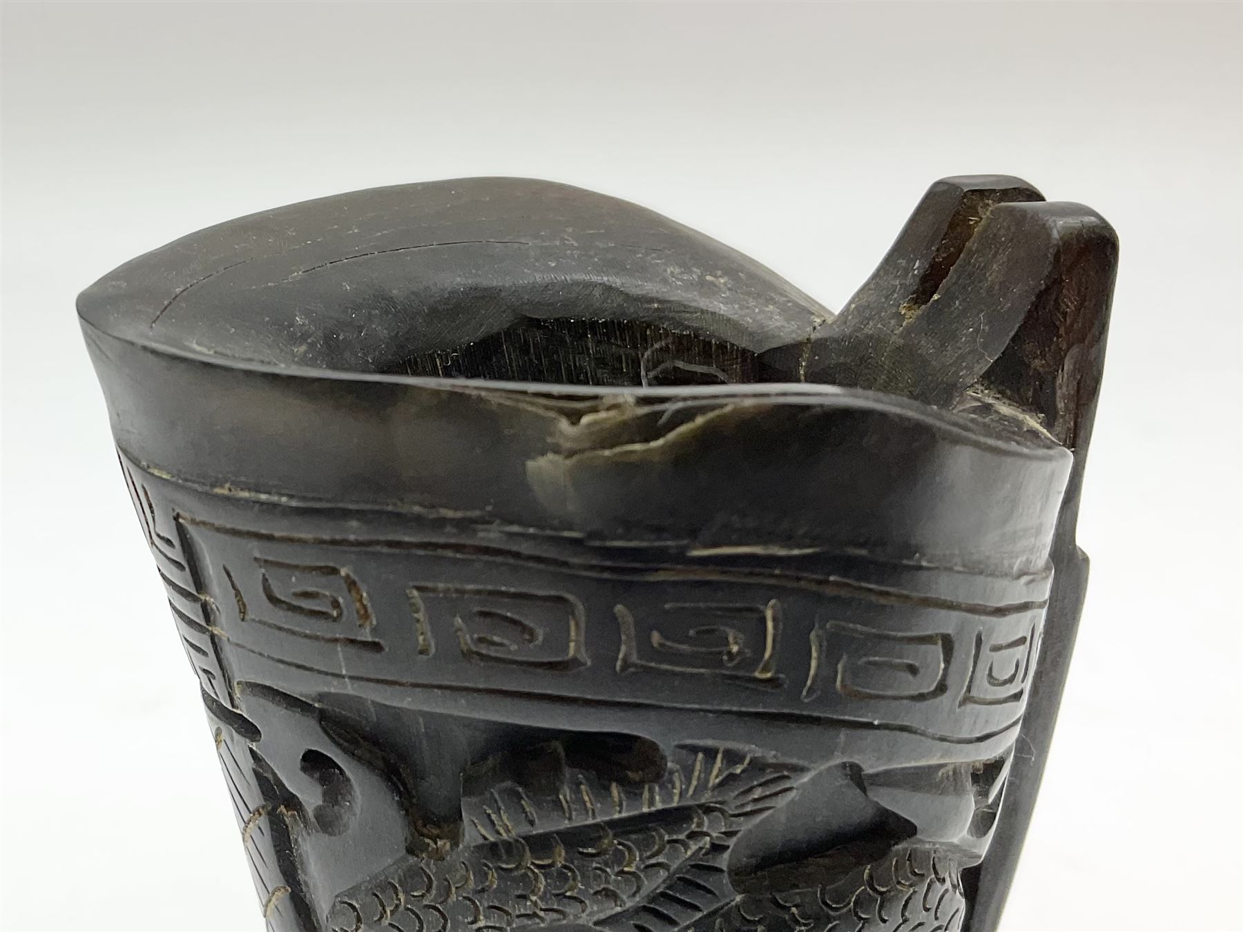 Chinese horn blood collection cup, carved with dragons and key fret border, H9.5cm