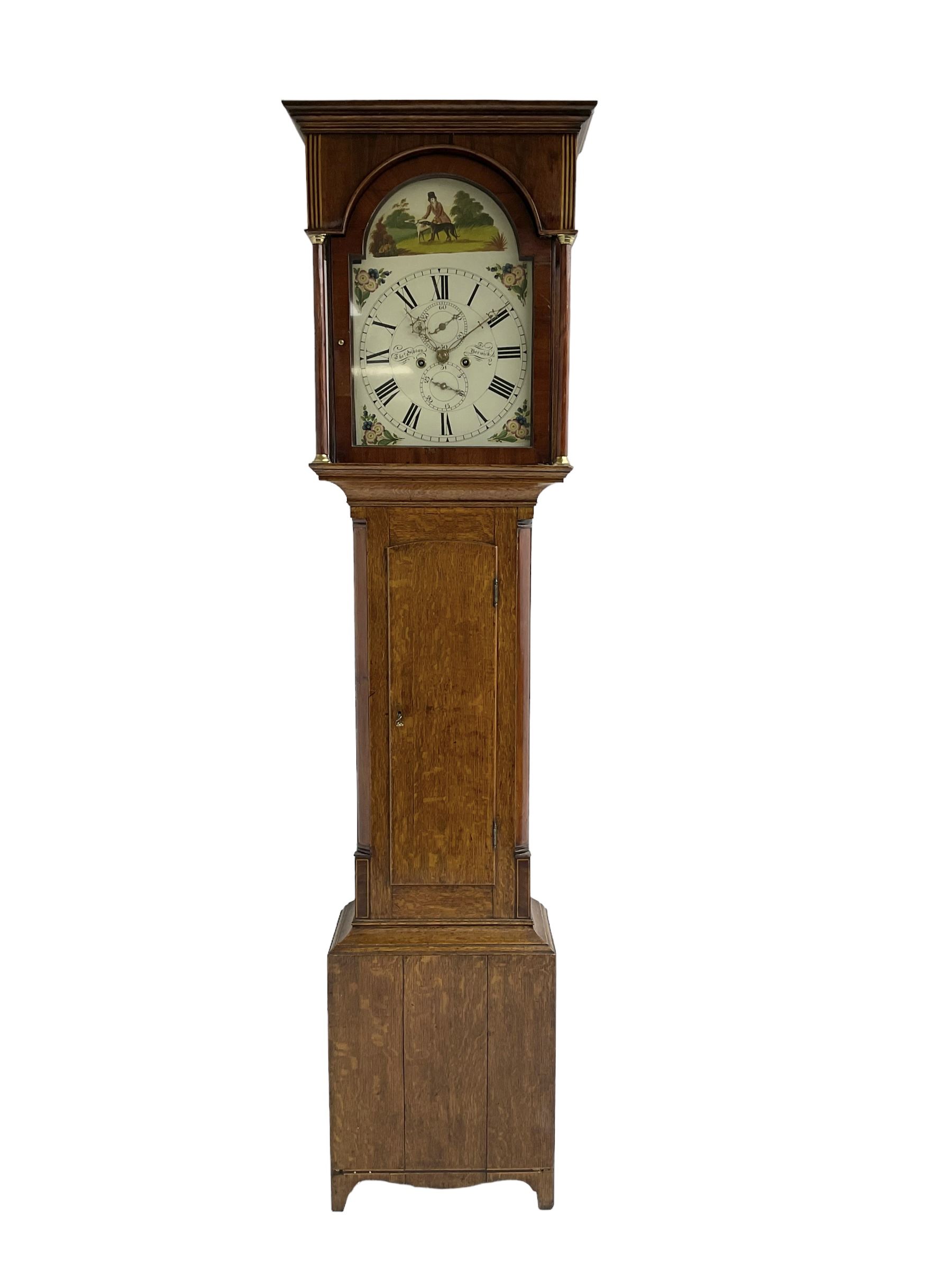 Thomas Gibson of Berwick - oak and mahogany 8-day longcase clock c 1860, with a flat topped pediment and recessed break arch door beneath, free standing pilasters with brass capitals, trunk with quarter columns to the corners and a wavy topped door, on a rectangular oak plinth with a shaped base,  painted dial with floral spandrels and a sporting scene to the break arch, Roman numerals, minute track and subsidiary seconds and date dial's, matching stamped brass hands pinned via a false plate to a rack striking movement, striking the hours on a bell. With weights, pendulum and key.   