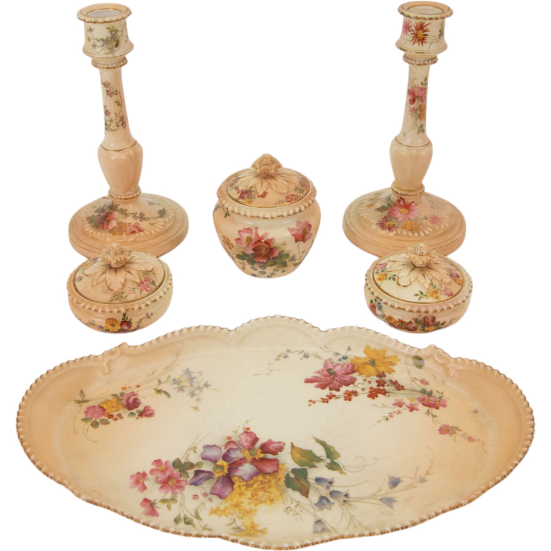 Royal Worcester blush ivory dressing table set, decorated with flowers, comprising an oval tray, three covered pots and a pair of candlesticks 