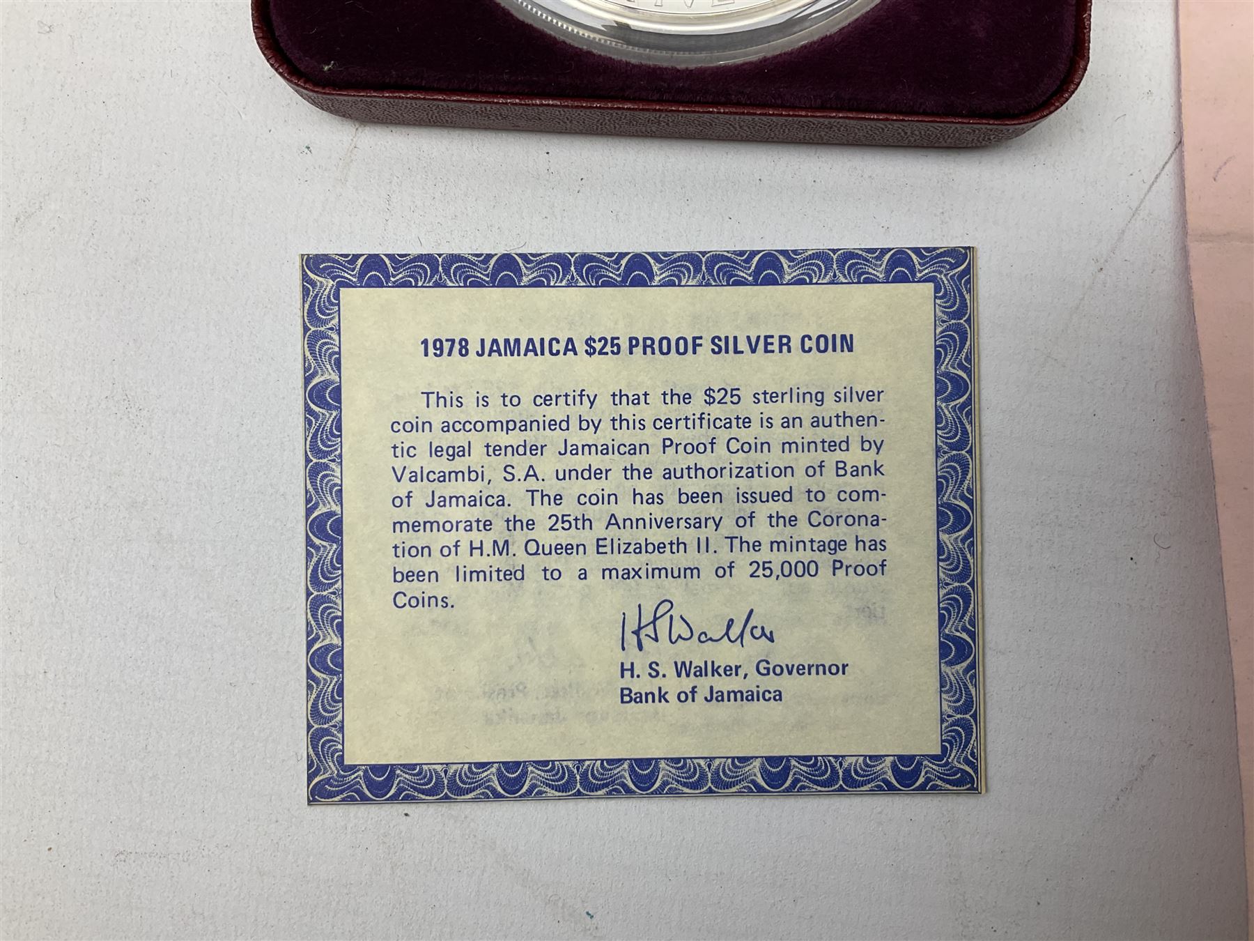 Jamaica 1975 eight coin proof set produced by the Franklin Mint and a Jamaica 1978 sterling silver proof twenty-five dollar coin, both cased with certificates