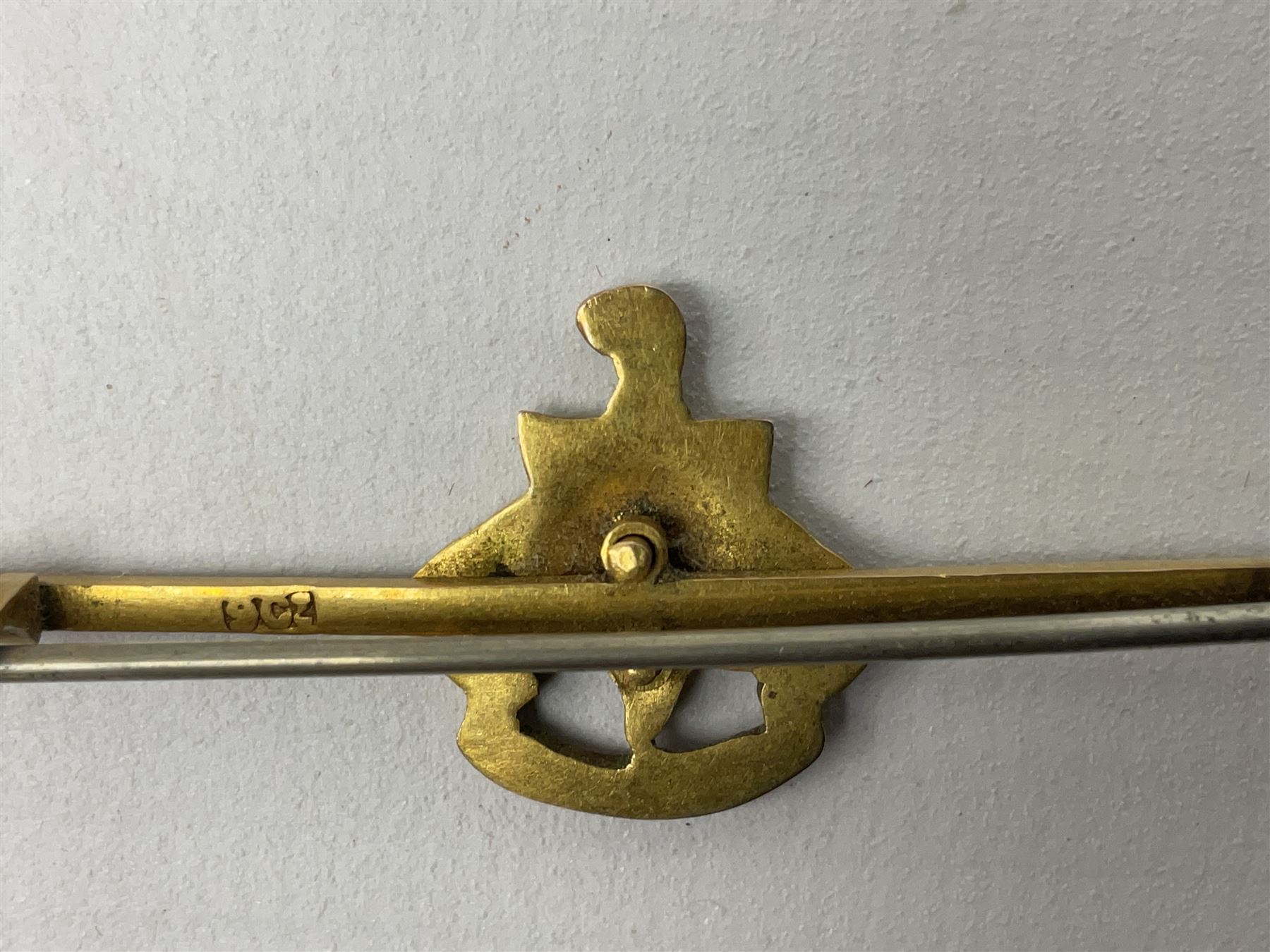 Royal Sussex Regiment 9ct gold sweetheart brooch with Regimental Association membership card to 6406670 Pte. Brock dated 1940; an 18ct gold pin badge enamelled with a shipping company (?) pennant; and an ARP button-hole badge (4)