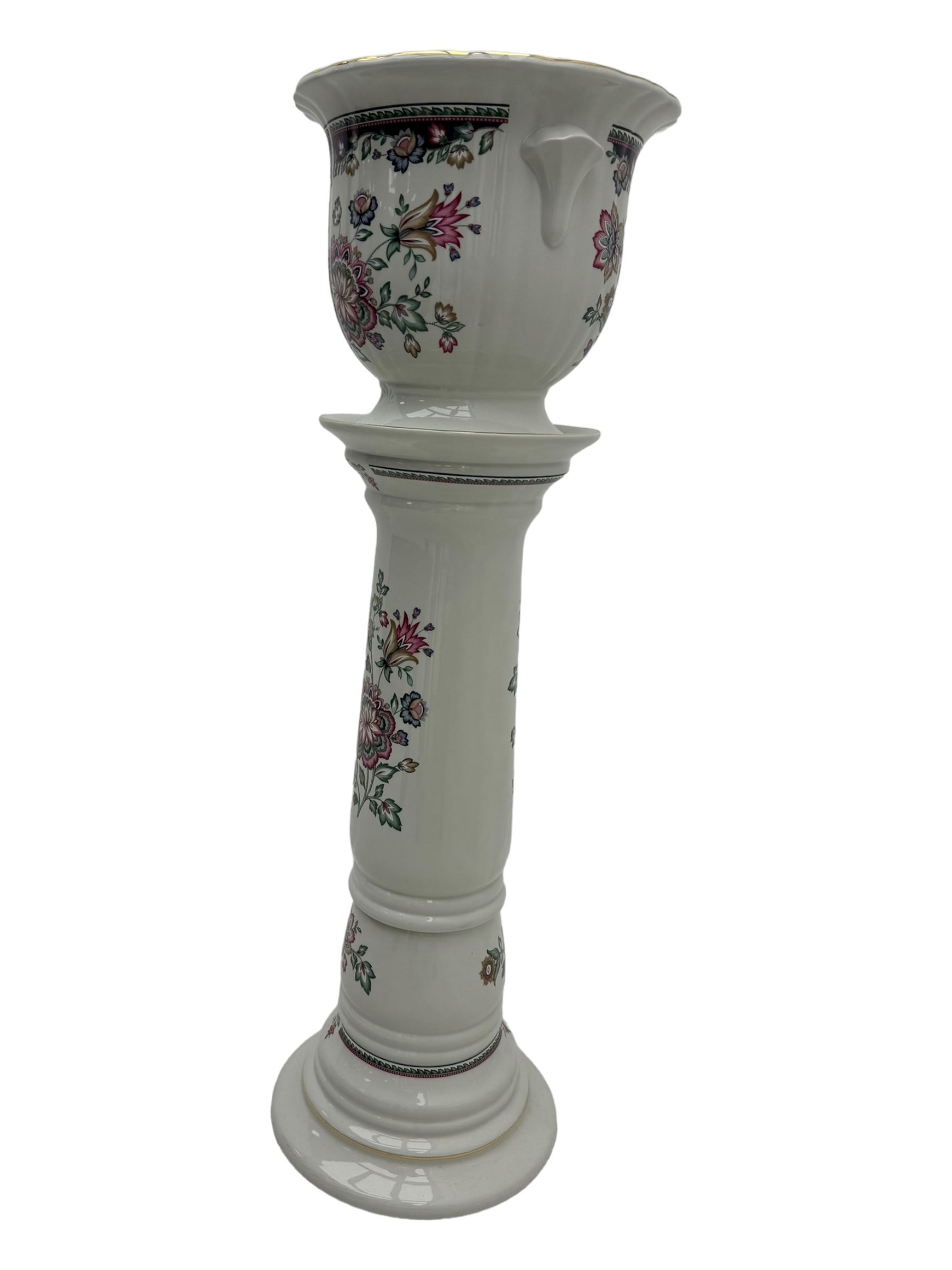 Royal Winton - early 20th century ceramic jardinière on stand, white ground with polychrome floral decoration, flared rim and twin handles, on circular base