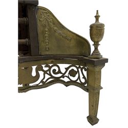 Regency cast iron and brass fire basket, the stepped arch back decorated with beading and urn motif, shaped front with brass fretwork frieze decorated with scroll work and bird motifs, turned finals over square tapering supports with spade feet (W78cm, H76cm, D40cm); early 19th century D-shaped fire fender with pierced latticework front (W113cm, H21cm, D24cm); early 19th century wrought metal fire fender (W108cm, H31cm, D23cm); and a collection of fireside tools 