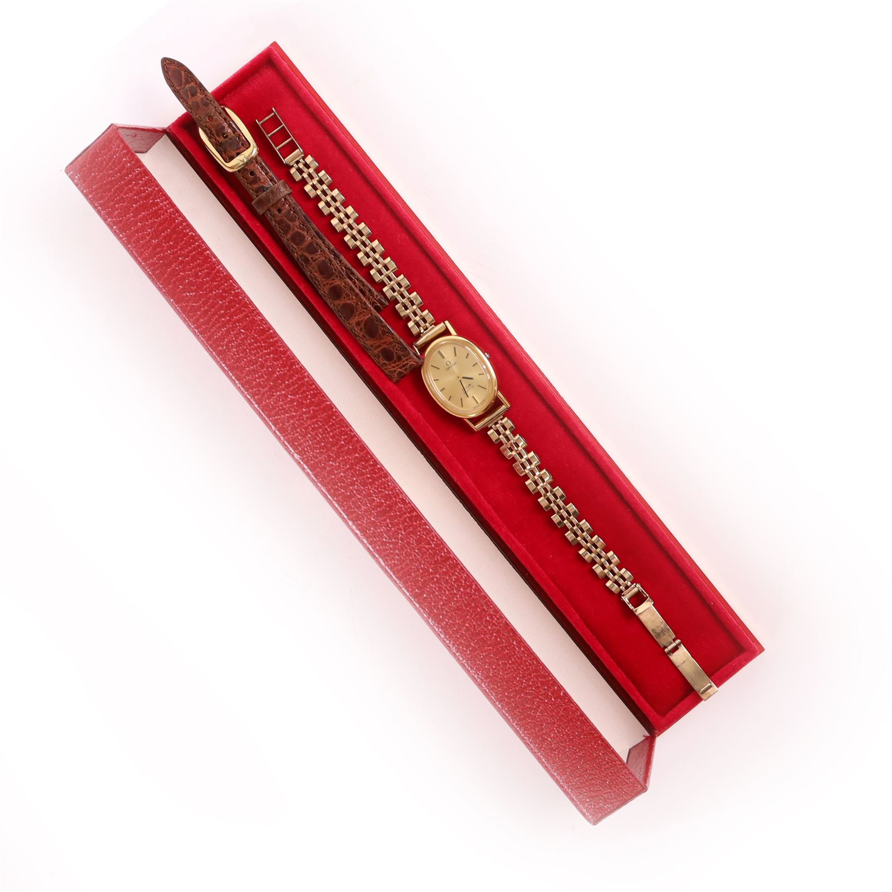 Omega ladies gold-plated quartz wristwatch, gilt dial with baton hour markers, on 9ct gold bracelet, Birmingham 1977, boxed with original leather strap