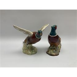 A collection of Beswick figures, comprising ginger cat model no 1898, ginger Persian kitten model no 1886, pheasant in flight model no 849, and pheasant model no 1226b.  