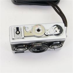 Rollei 35 35mm compact viewfinder camera made in Singapore, with Tessar 3.5/40 lens in silver and black finish serial no. 6221766, in a Rollei soft shell case