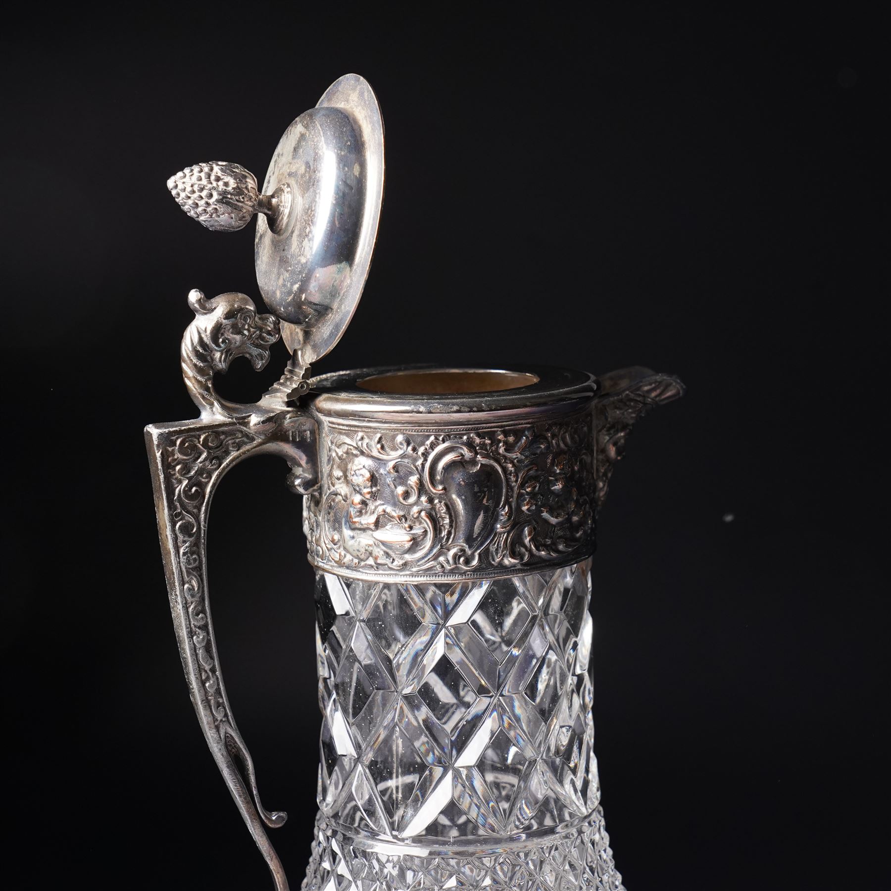Square glass scent flask with silver collar and facet cut stopper Birmingham 1990, another and a glass claret jug with plated mounts