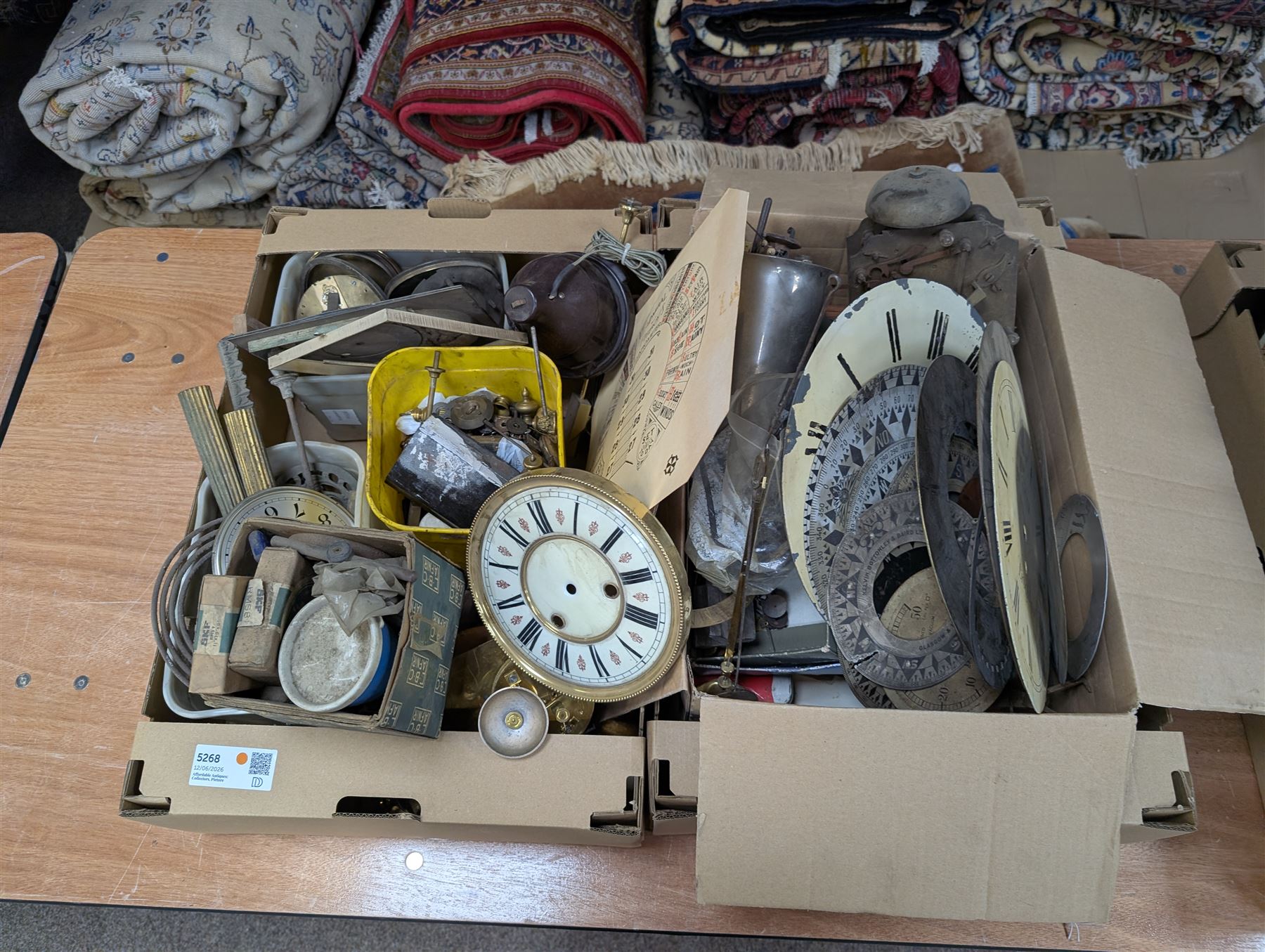 Collection of clock parts and accessories, including movement, faces, dials, tools, brass fittings, etc, in three boxes