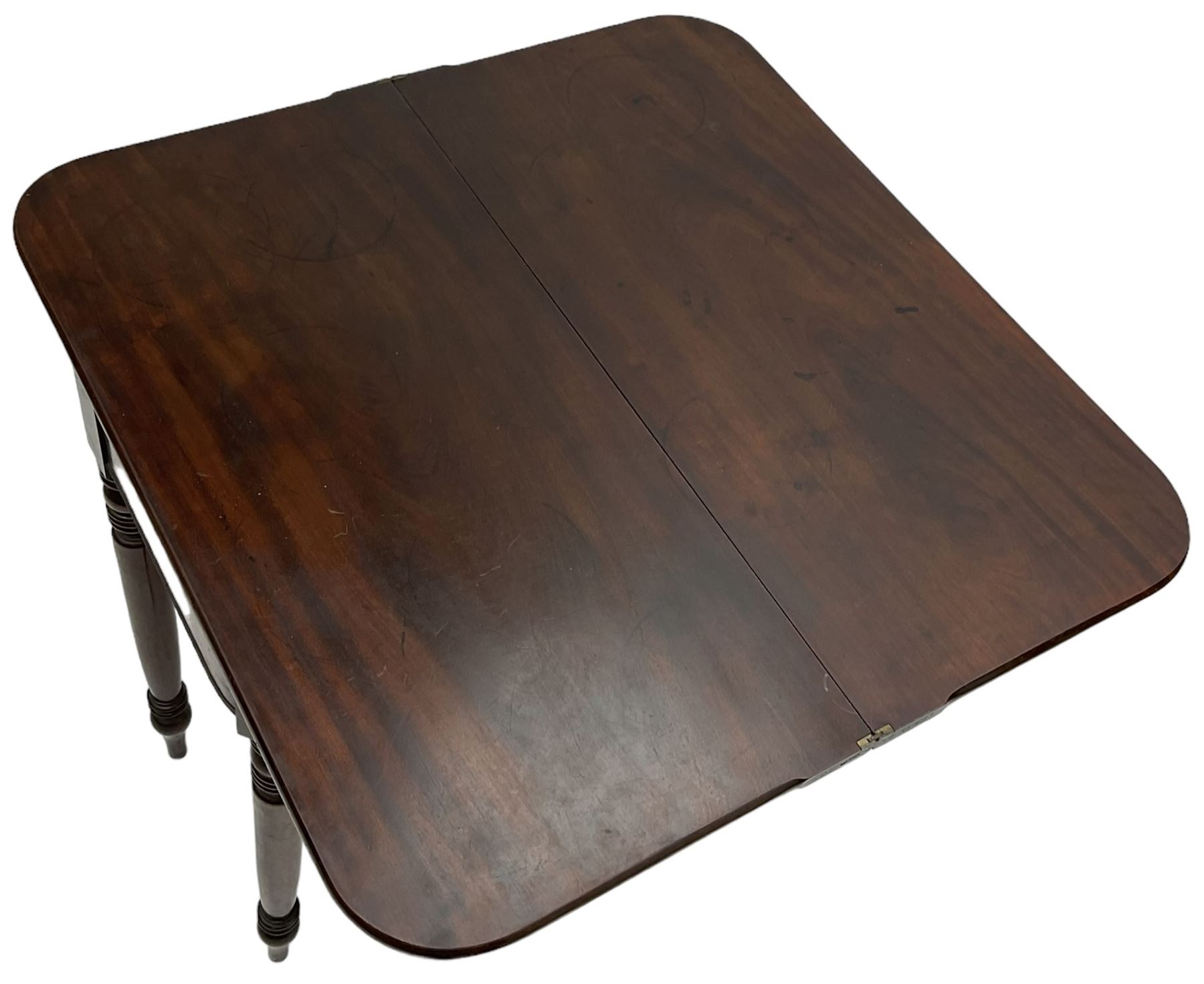 Victorian mahogany tea table, rectangular swivel fold-over top with rounded corners, on ring turned supports 