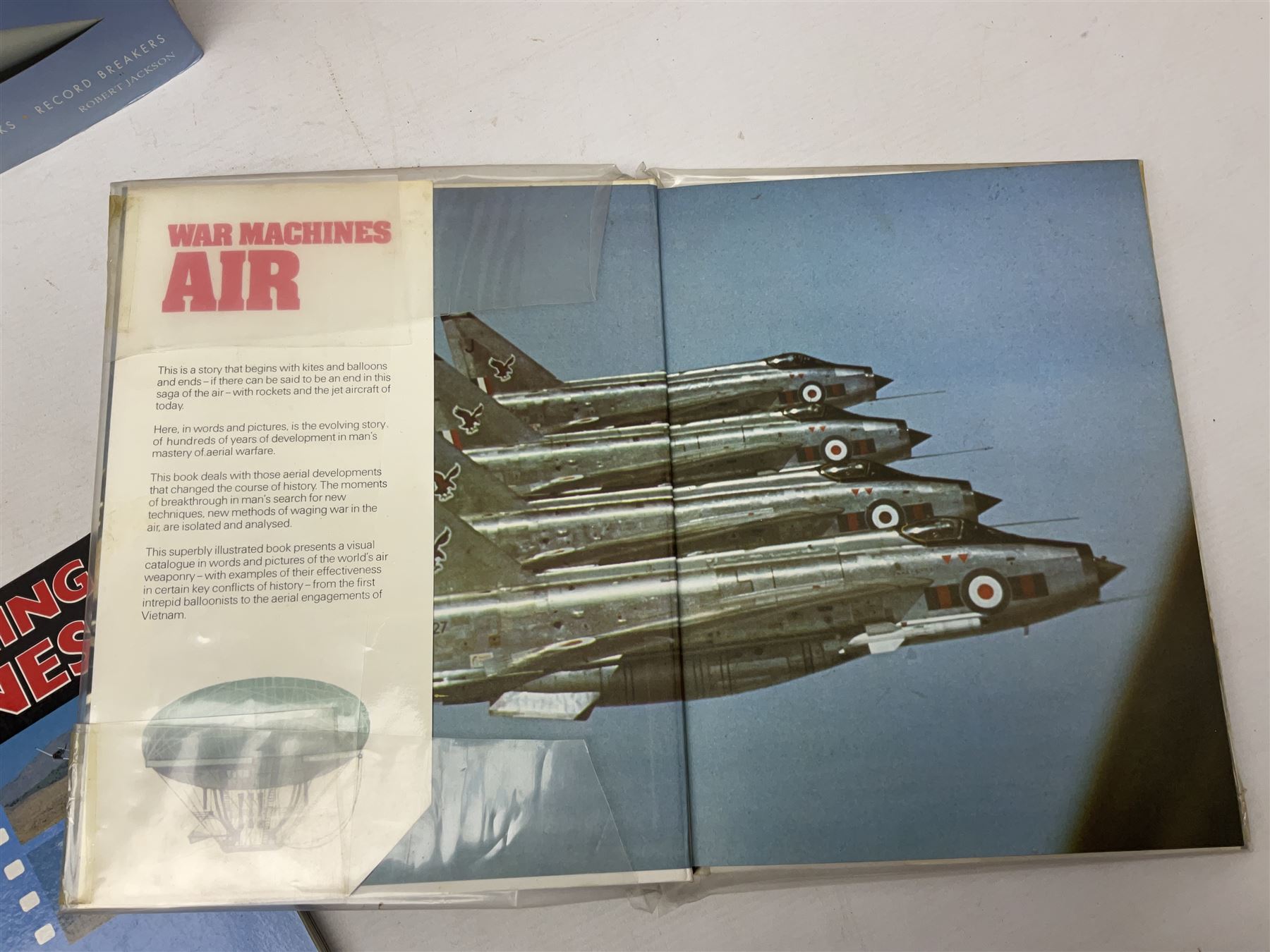 Ten books of predominantly military aircraft interest including Aircraft Anatomy World War Two, Hurricane Messerschmitt, The Avro Lancaster, The Luftwaffe Album, Encyclopaedia of Aircraft of WWII etc; together with a scrap album of WW2 newspaper cuttings