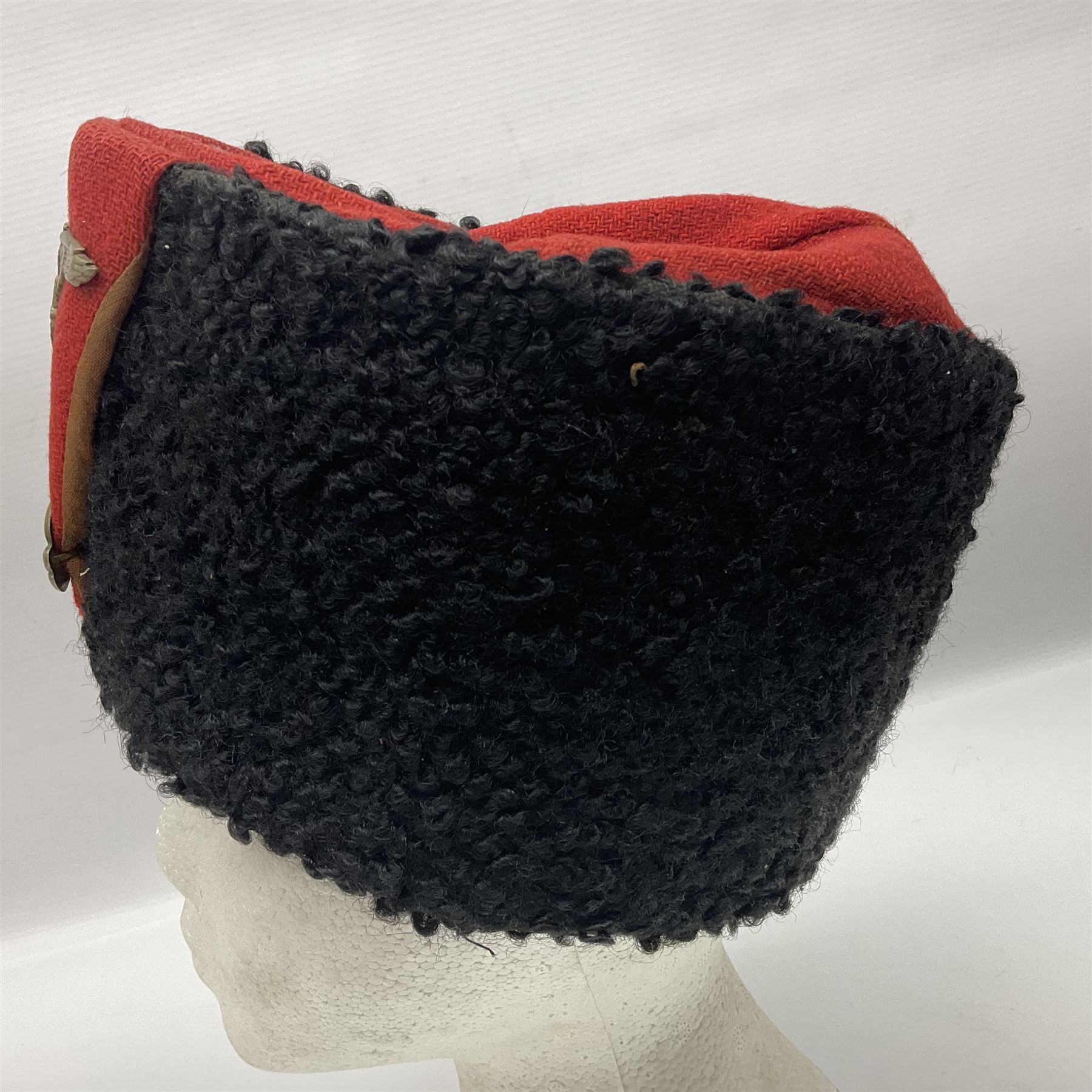 WW2 German small size Balkan style hat with 'SS' metal badges; red cloth top and flash to front with black persianelle type sides; lined in brown card with leather sweatband