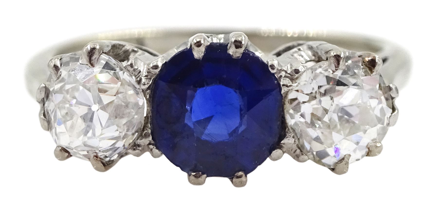 Early 20th century gold three stone old cut diamond and round sapphire ring, sapphire approx 0.60 carat, total diamond weight approx 1.00 carat