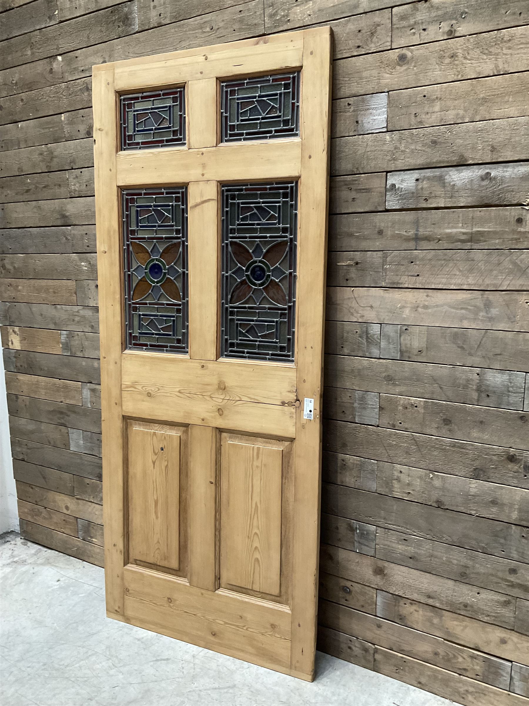Early 20th century pine six panel door with later stained glass panels