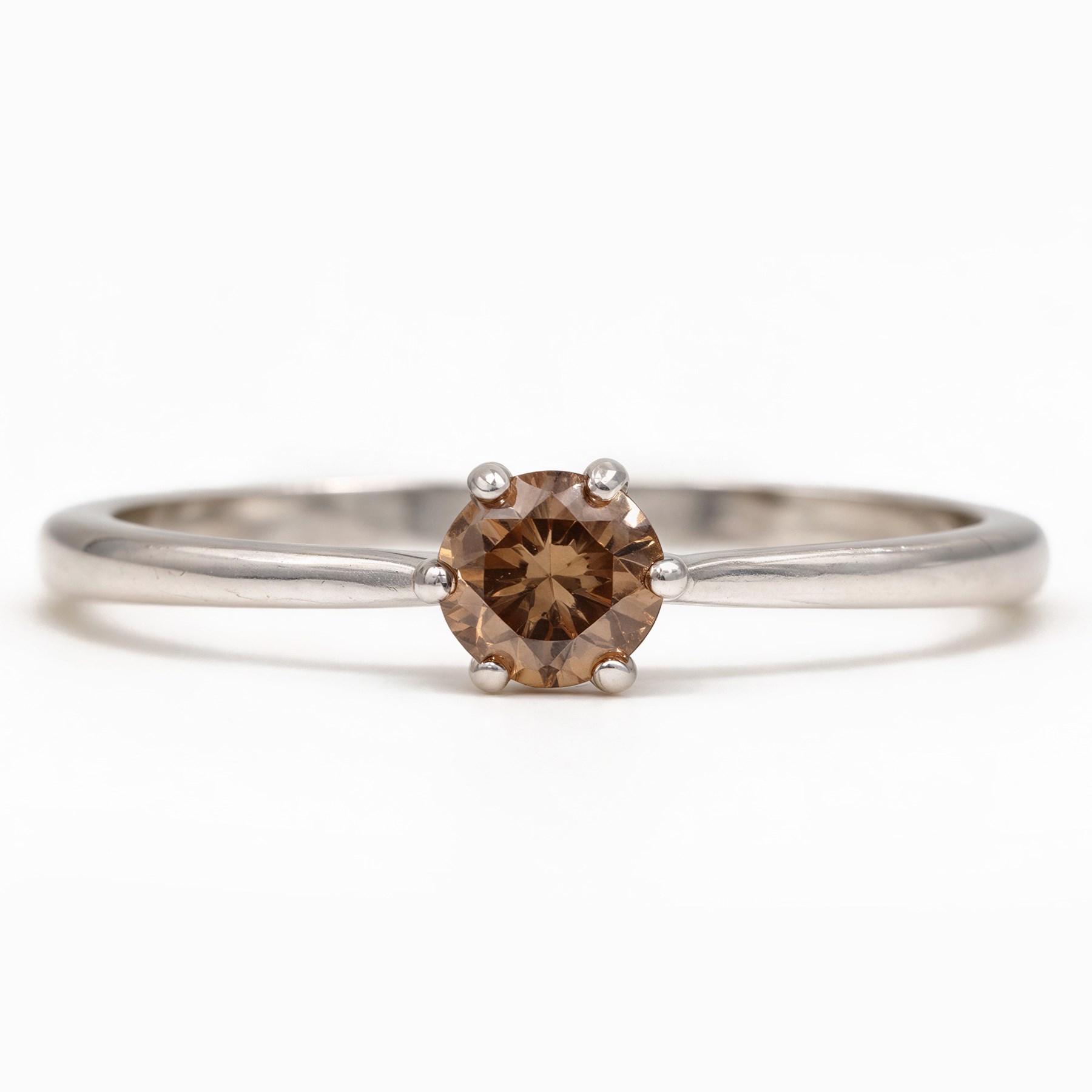18ct white gold fancy brown diamond ring, six claw set with a round brilliant cut diamond of approx 0.80 carat, hallmarked