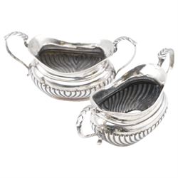 Group of silver, comprising 1930s five bar toast rack, hallmarked B & W Ltd, Birmingham 1931, three piece Edwardian silver cruet set comprising two open salts and a pepper shaker, hallmarked E J Trevitt & Sons, Chester 1904 and a small 1930s silver sauce boat, hallmarked Edward Barnard & Sons Ltd, London 1937 