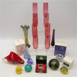  Set of eight champagne flute with cranberry glass bowls, Swarovski Xmas 1983 paperweight, boxed, Caithness paperweights, Victorian glass paperweight with coloured flower head inclusions and other glassware  