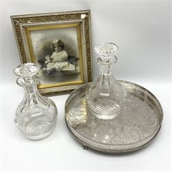 Two cut glass decanters and stoppers, together with a silver plated tray of circular form with pierced gallery and foliate decorated centre, and a framed 19th century photograph, in one box 