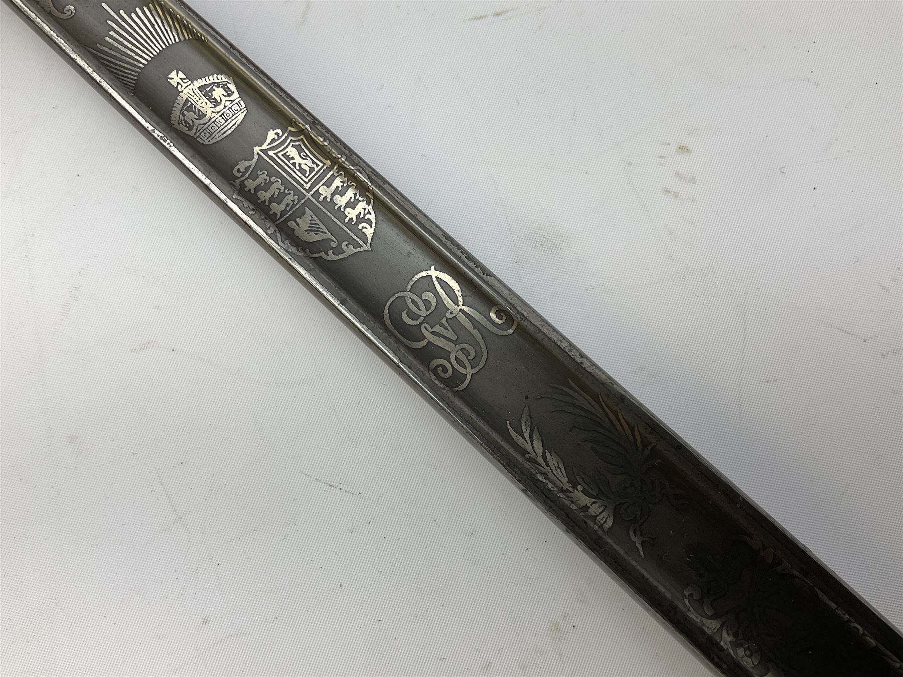 British George V 1897 Pattern Infantry Officers Sword, the 82.5cm fullered steel blade etched and polished with crowned royal arms, GRV cyphers and scrolling foliage, marked Army & Navy Co-operative Society 105 Victoria St London SW to the ricasso,  plated pierced basket hilt with wire bound fish skin grip and leather knot, No.15032; in leather covered scabbard