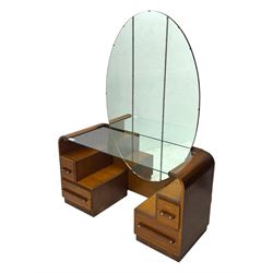 Early 20th century Art Deco walnut dressing table, featuring a large oval triptych mirror above a stepped base, fitted with four drawers and a central glass shelf, all raised on a plinth base