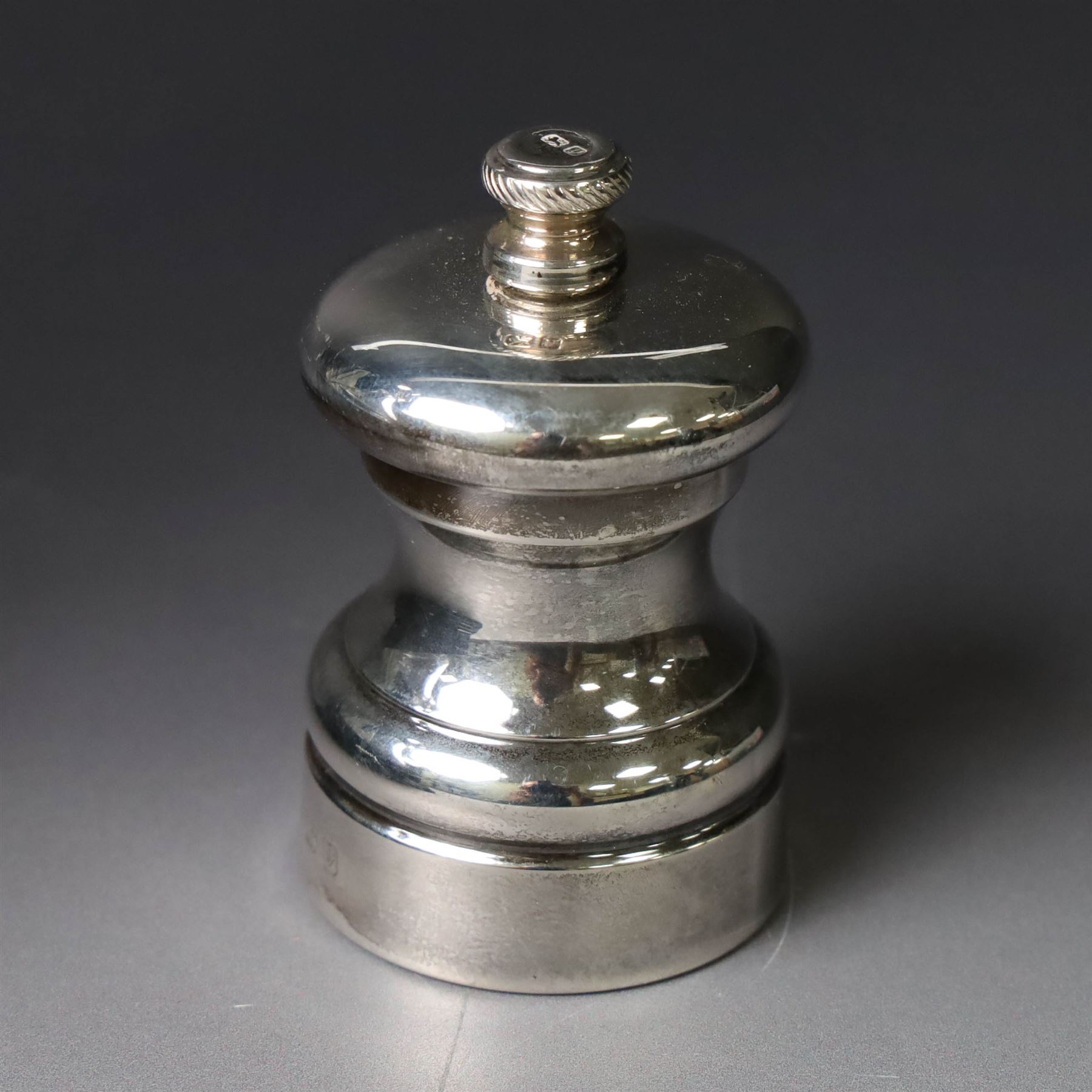 Silver mounted glass decanter, boxed with wooden plinth, together with a silver pepper grinder and a silver mounted Carrs desk clock, all hallmarked