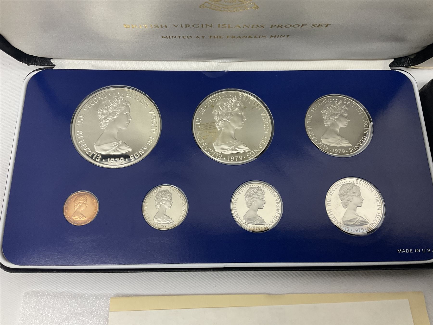 Four British Virgin Islands proof coin sets, comprising First Coinage of the British Virgin Islands 1973 proof six coin set, containing silver one dollar coin, 1977 and 1979 proof sets, containing high denomination silver coins, and The Royal Coronation Jubilee 1977 six coin silver proof set, each minted at the Franklin Mint, all cased with certificates, and a Solomon Islands 1978 proof seven coin set, containing silver five dollar coin, minted at the Franklin Mint, cased with certificate (5)