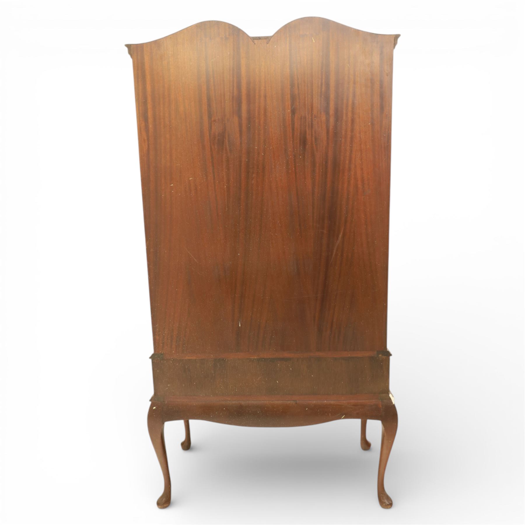 Queen Anne design walnut display cabinet, carved cartouche above two glazed doors enclosing two fixed glass shelves, over two frieze drawers above a heavily carved apron with cabriole supports