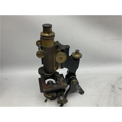 19th century brass and black japanned monocular microscope by W. Watson & Sons Ltd. 313 High Holborn, London serial no.24788 with rack and pinion focussing on tripod base H31cm; in fitted mahogany case retailed by A.H. Baird Scientific Instrument Makers Edinburgh; quantity of additional lenses and accessories; together with another similar uncased monocular microscope by W. Watson serial no.58379 (2)