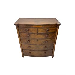 Victorian mahogany bow-front chest, fitted with two short and four long cock-beaded drawers, flanked by pilasters, raised on turned feet