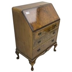 Mid-20th century walnut bureau desk, figured fall front enclosing fitted interior, three graduating drawers below, on cabriole feet