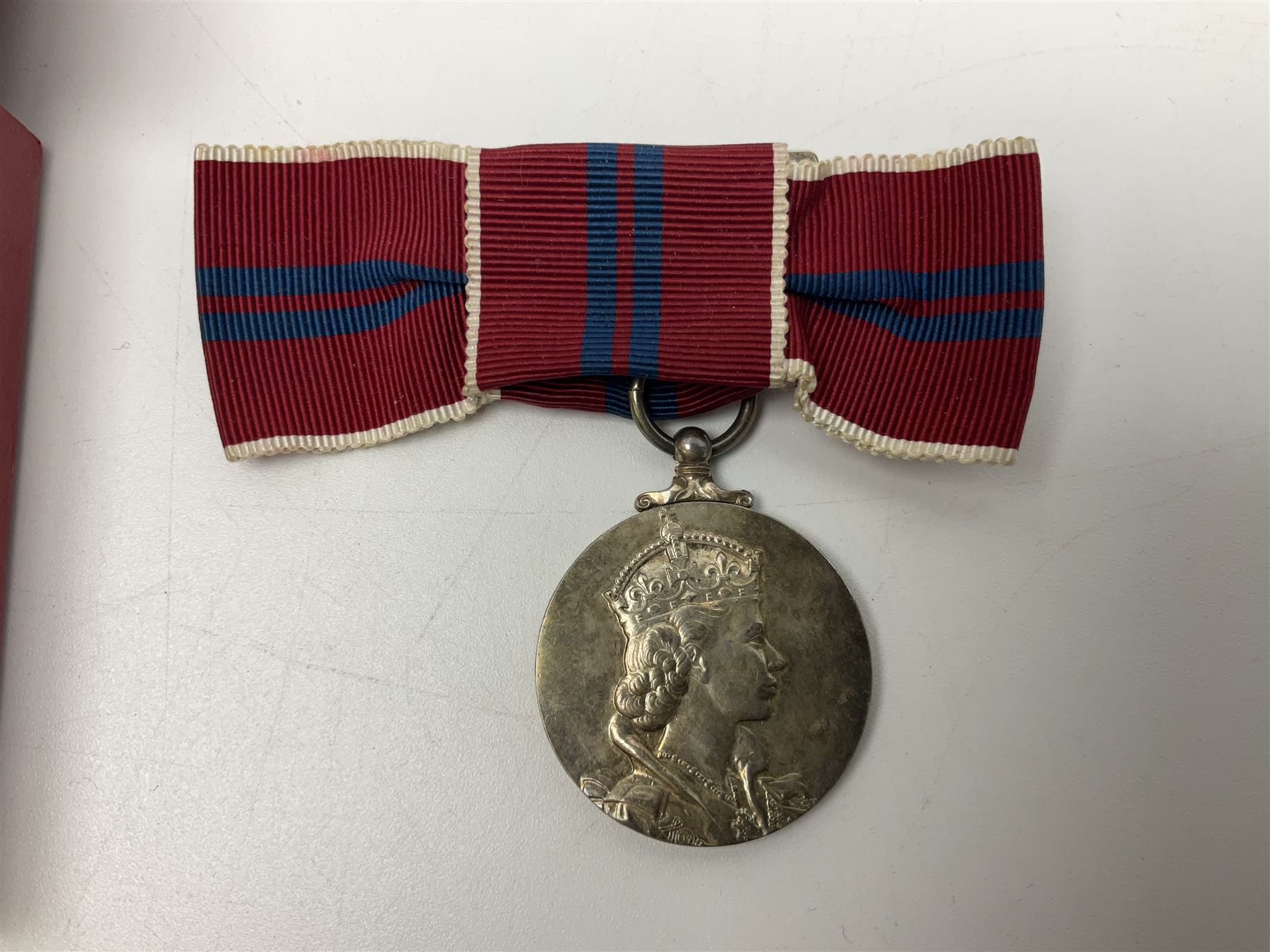 Commemorative medallions or medals including three Queen Victoria Diamond Jubilee small silver medallions, two King Edward VII 1902 Coronation medallions and a Queen Elizabeth II 1953 Coronation medal in red box