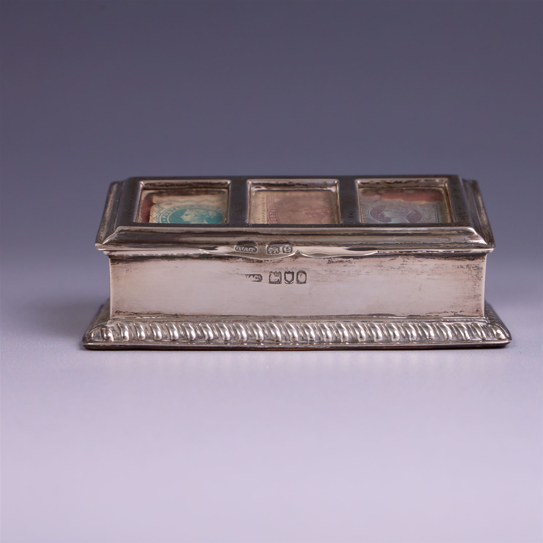 Late Victorian silver mounted stamp box, the hinged lid with three glazed panels, hallmarked Grey & Co, London 1900, together with a late Victorian silver hair comb and a cased set of six silver coffee spoons