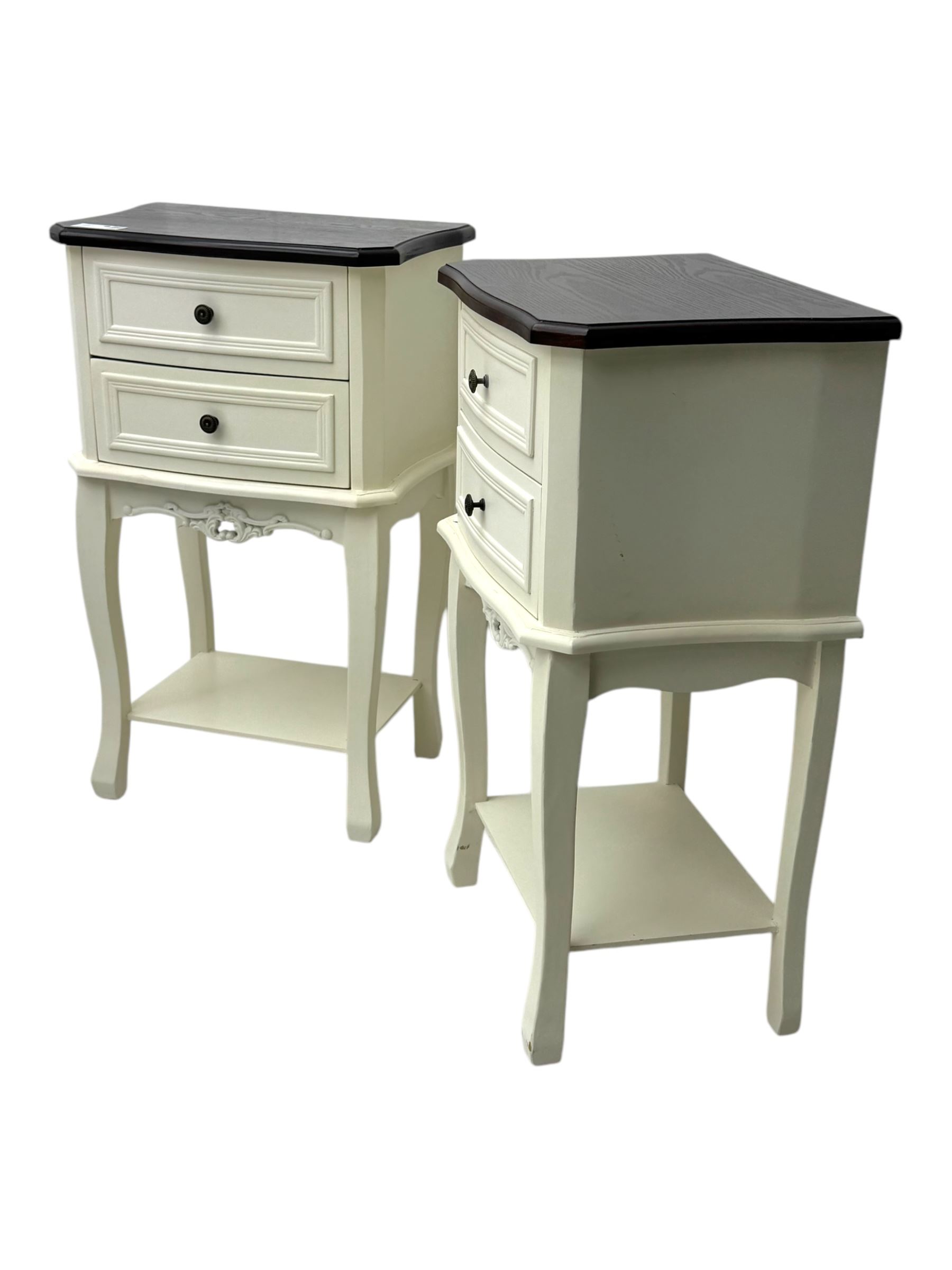 Pair of French design white painted bedside lamp tables, with painted wooden tops, above two drawers with carved apron and undertier, shaped legs  