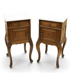 Pair of 20th century French honey oak and marble bedside cabinets, the square marble top w...