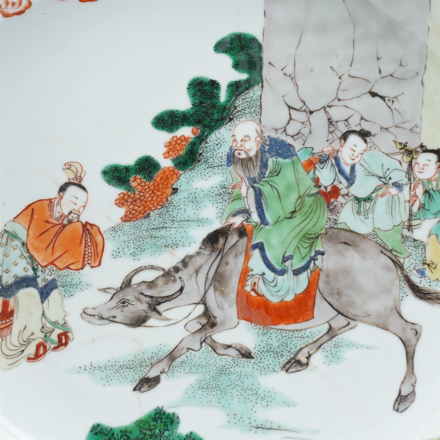 Chinese Kangxi famille verte dish, decorated with Laozi seated on the back of a buffalo greeting a bowing figure, D27cm