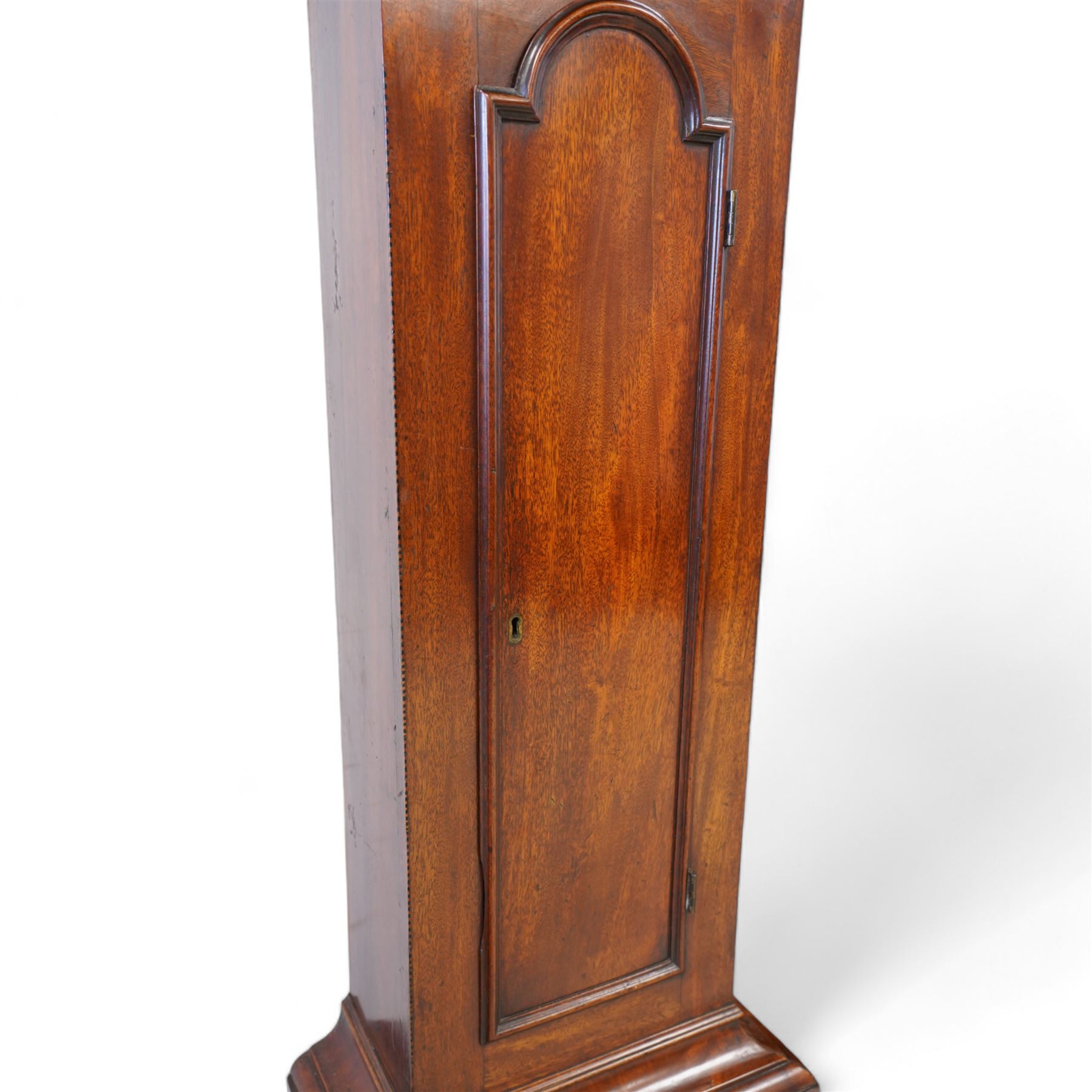 Johnathan Storr of York - 30 hour longcase clock c1770, in a later mahogany case with a decorative swan neck pediment, carved gilded eagle and fretwork, with a dogtooth moulding, break arch hood door and detached pilasters beneath, trunk with a conforming break arch topped door on a square plinth with raised moulding and bracket feet, brass arched dial with makers name to the arch, plain dial centre and silvered chapter ring with Roman numerals, five minute Arabic's, minute track and matching steel hands, chain driven movement with a countwheel strike on a bell. No Pendulum or weight.
Johnathan Storr was an 18th century York clockmaker, working from Petergate and Minster gates in the city centre.