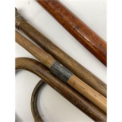 Five walking sticks, to include three silver mounted examples 