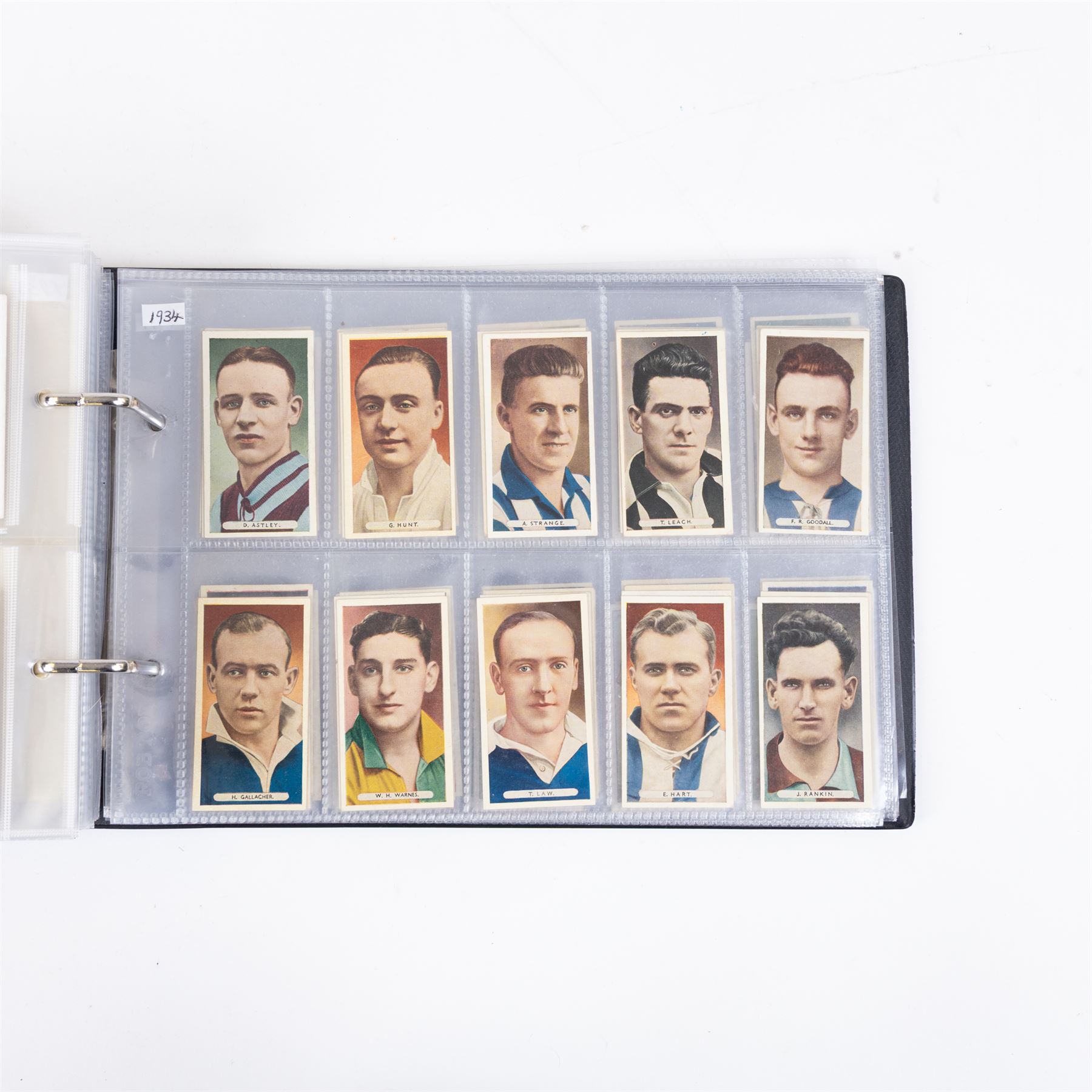 Collection of Edwardian and later Football related trading and cigarette cards, including forty-nine of fifty 1906 Ogden's Football Club Colours, 1922 PALS Footall series, ninety of one hundred 1925 Gallaher Famous Footballers, complete set of forty-four 1926 Ogden's Captains of Association Football Clubs and Colours, complete set of fifty 1927 Players Football Caricatures by MAC,  complete set of fifty 1927 Players Football Caricatures by RIP,  complete set of fifty 1930 Players Association Cup Winners, complete set of 50 1933 Ogdens AFC Nicknames etc, housed in brown cigarette card album