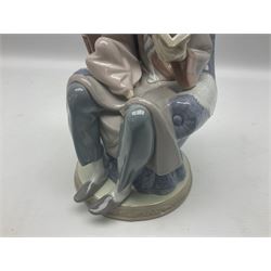 Lladro figure, Fathers Day, modelled as a man reading to his daughter, sculpted by Juan Huerta, in original box, no 5584, year issued 1989, year retired 1996, H22cm