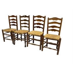 Harlequin set of nine country elm and beech chairs - pair 19th century spindle back carver armchairs with wingbacks, and a mixed set of seven ladderback side chairs, all with rush seats